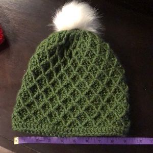 Olive colored handmade crochet beanie. New w/o tags. Interchangeable pom pom.